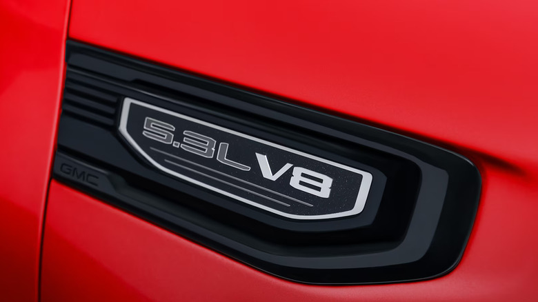 V8 emblem on red GMC Sierra 1500