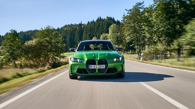 BMW M3 driving on a country road