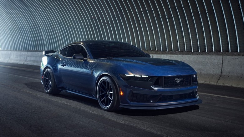 Ford Mustang Dark Horse driving in a tunnel