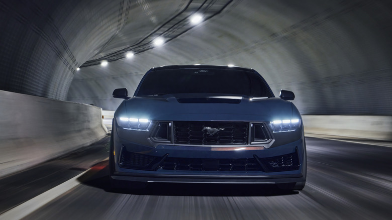 Ford Mustang Dark Horse driving in a tunnel