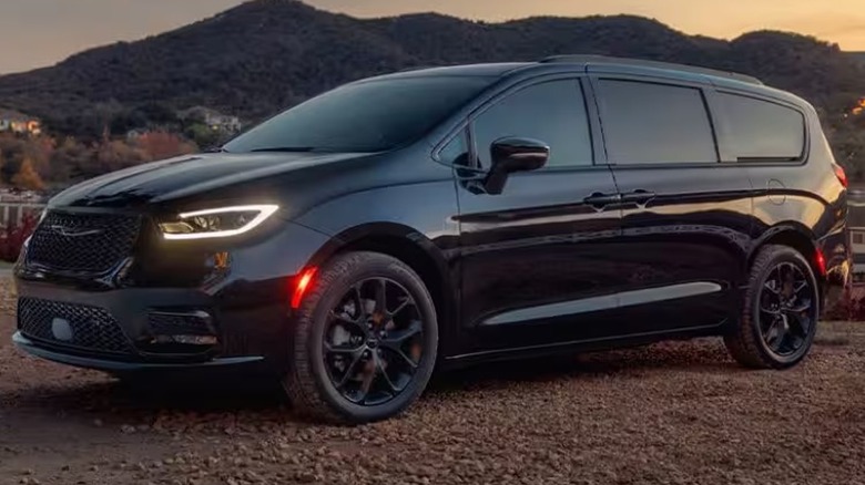 2025 Chrysler Pacifica In Black Near Body Of Water At Dusk