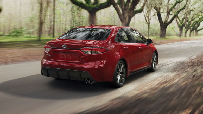 Toyota Corolla Hybrid driving in the woods