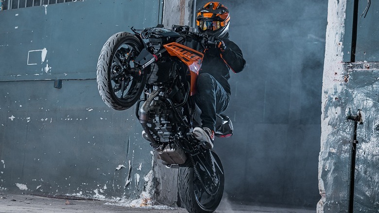 Man pulling wheely on KTM 125 Duke