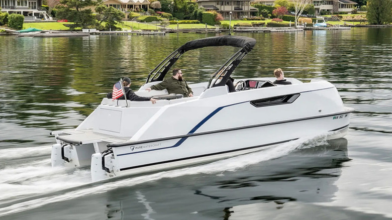 people riding in pure watercraft pontoon