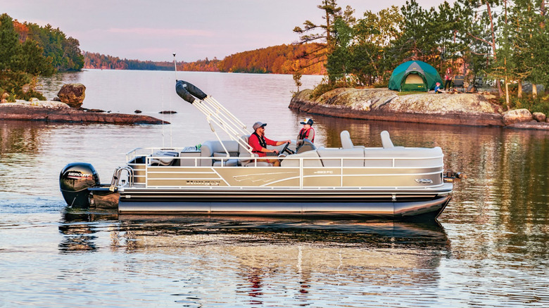 people riding on ranger pontoon