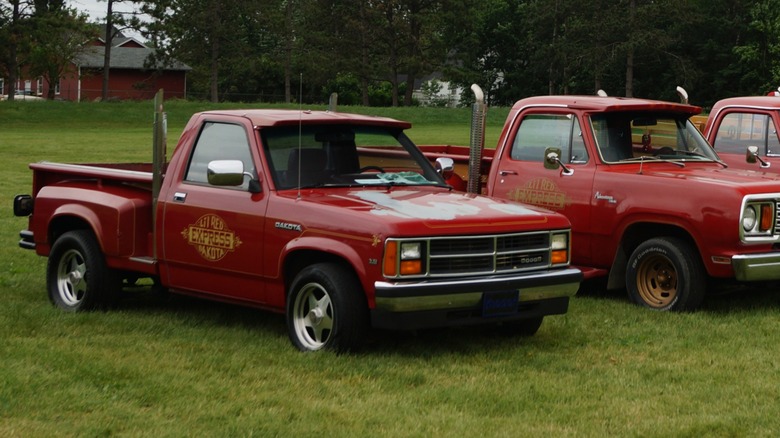 1990 Dodge Dakota Li'l Red Express next to original full-size versions.