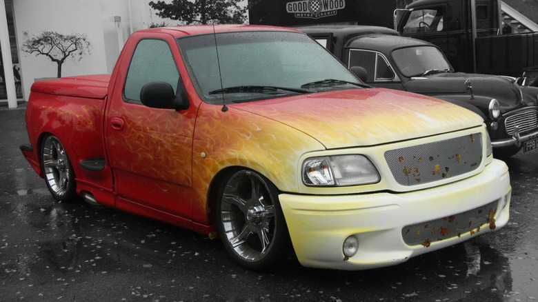 A 1999 Ford SVT F-150 Lightning with custom paint.