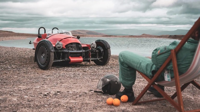 Person in chair by Morgan Motor Company Super 3