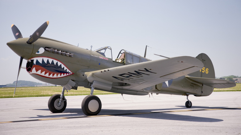 Render of Cutiss P-40 Warhawk parked on runway