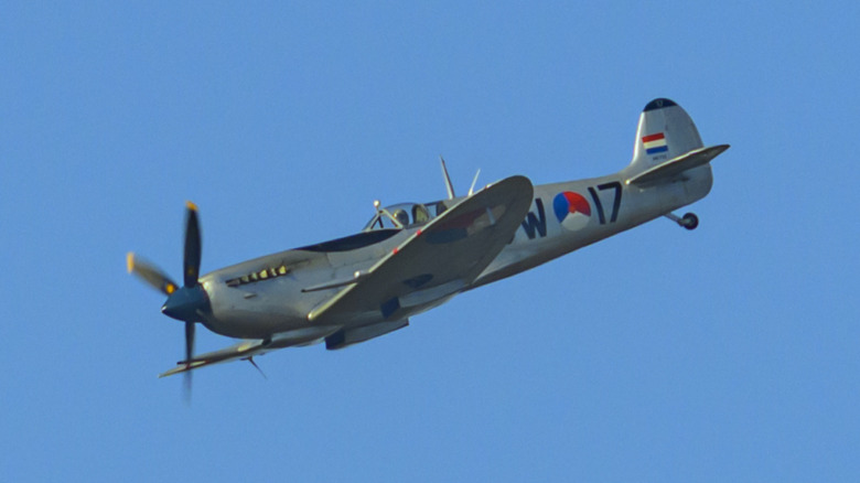 Spitfire flying in clear blue sky