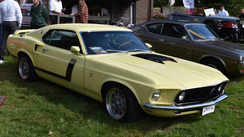 A yellow Ford Mustang Boss 351