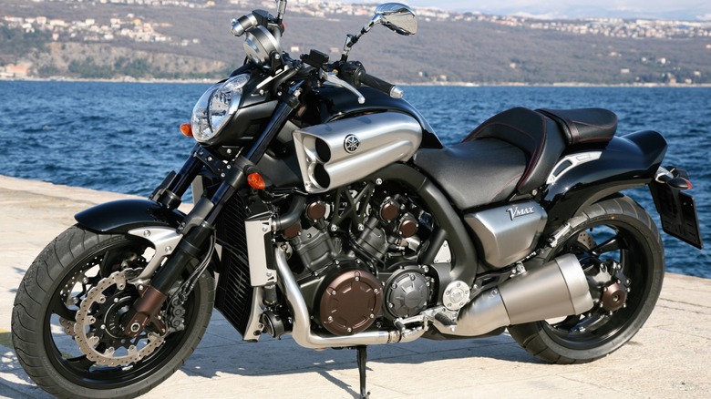 A Yamaha VMAX parked on a waterfront.