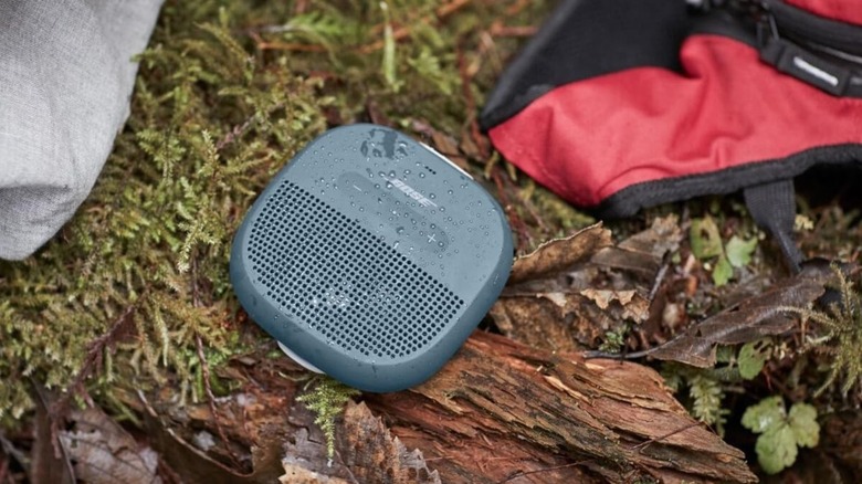 JBL Go 3 on the ground covered in drops of water