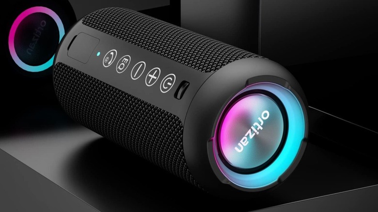 Ortizan Portable Bluetooth Speaker with glowing LED against black background