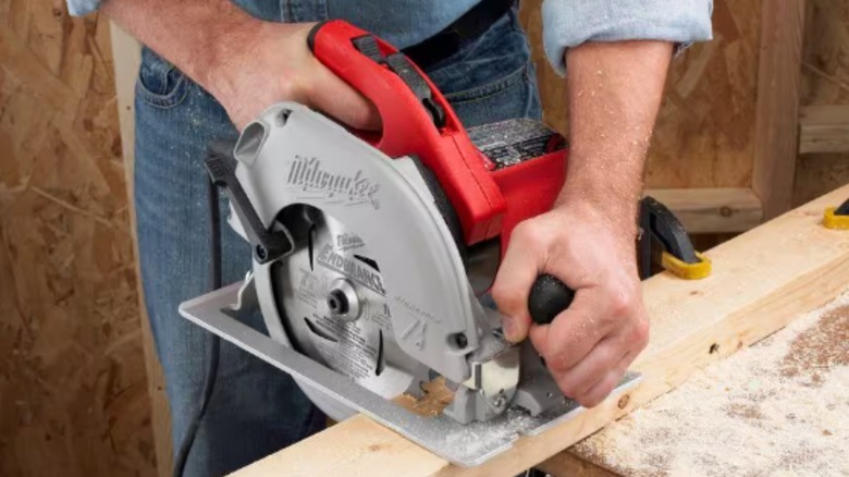 milwaukee circular saw cutting two-by-four