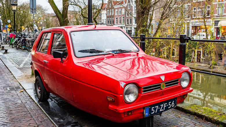 Red Reliant Robin on city street