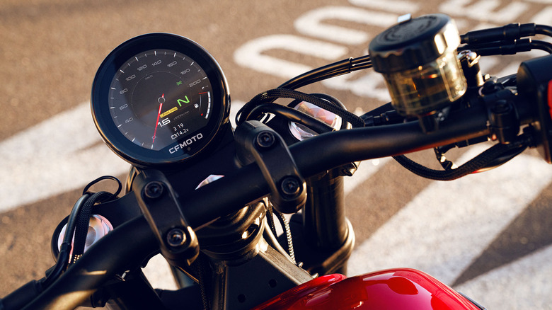 A close up of a CF Moto 450 CL-C's speedometer display