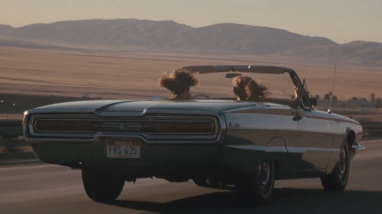 Thelma and Louise driving down road