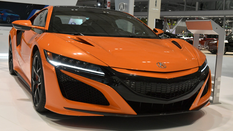 Orange Acura NSX at dealership