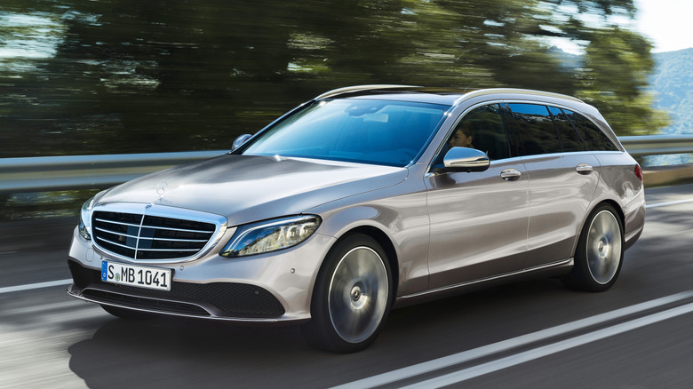 Silver Mercedes-Benz C 300 d diesel wagon on a road