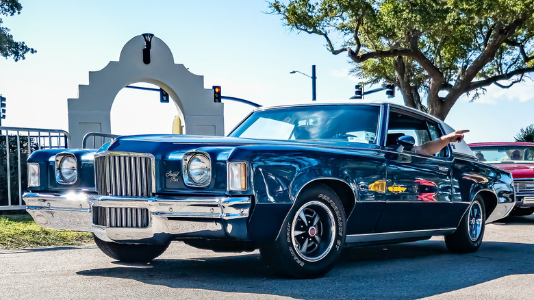 blue1971 Pontiac Grand Prix with driver's arm out window