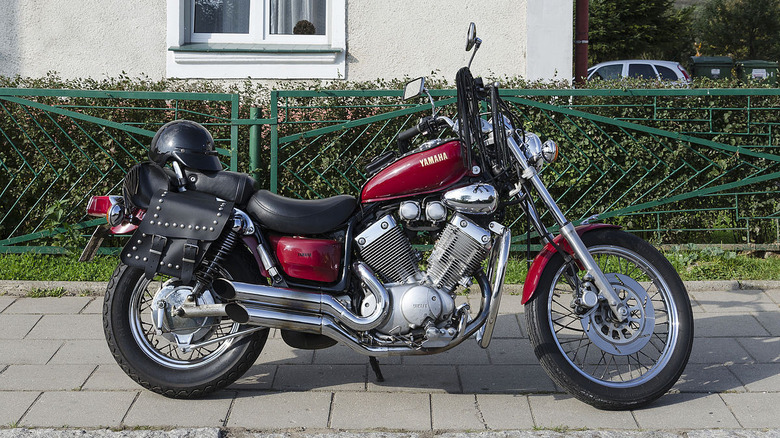 Yamaha Virago XV535 parked outside of a house.