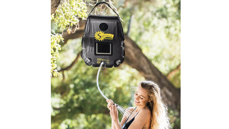 Camper using Advanced Elements 5-gallon Solar Summer Shower