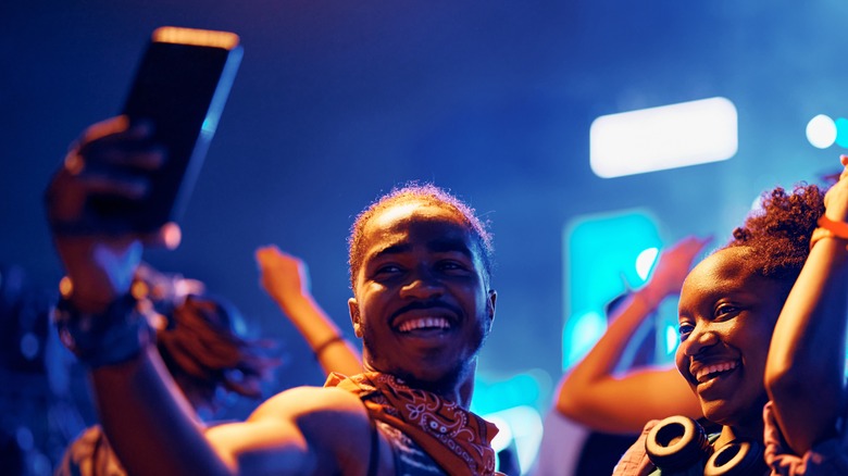 man and woman taking selfie