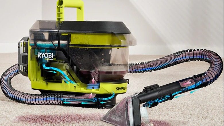 One+ HP 18V SwiftClean Mid-Size Spot Cleaner cleaning a purple stain on a carpet