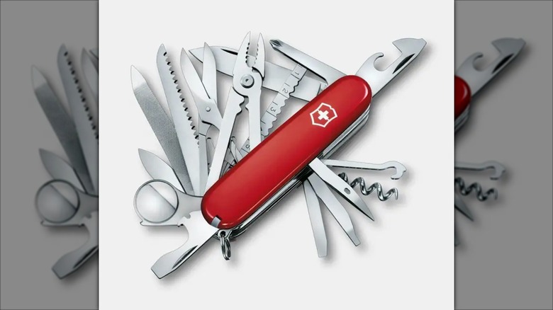 Red Swiss Champ with all the tools open