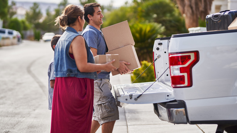 A family loads their pickup