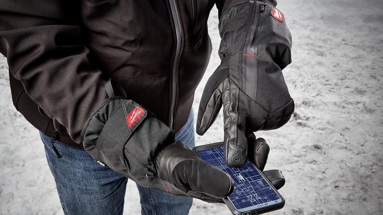 USB Rechargeable Heated Gloves used in cold weather to use phone touchscreen