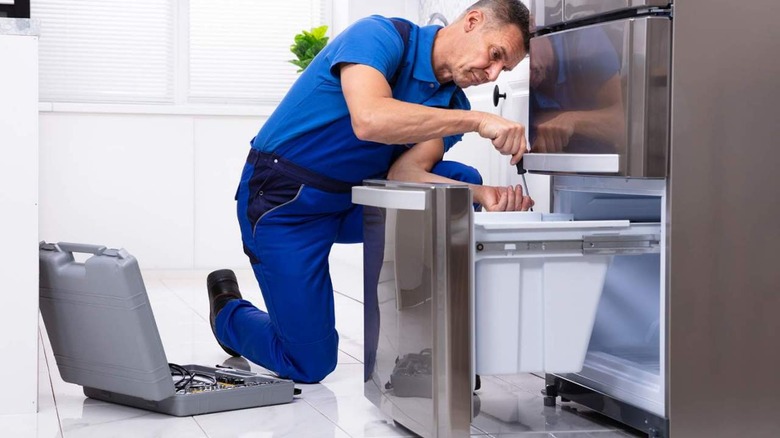 smart fridge being repaired 