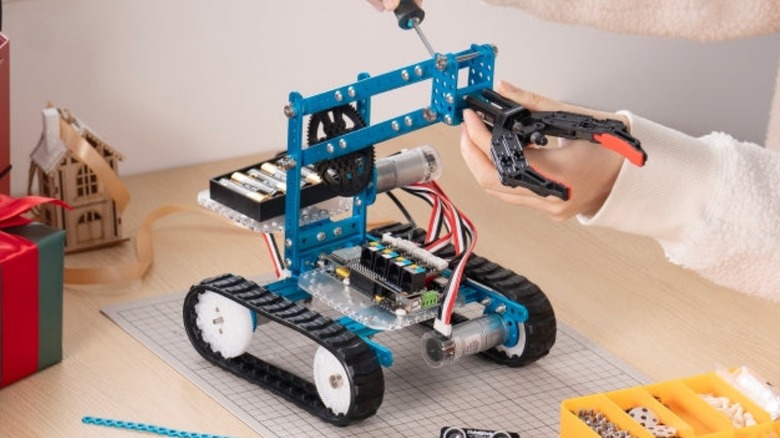 Person building Makeblock mBot Ultimate 2.0