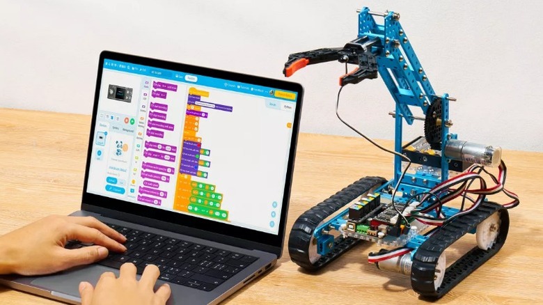 Makeblock mBot Ultimate 2.0 on table beside laptop