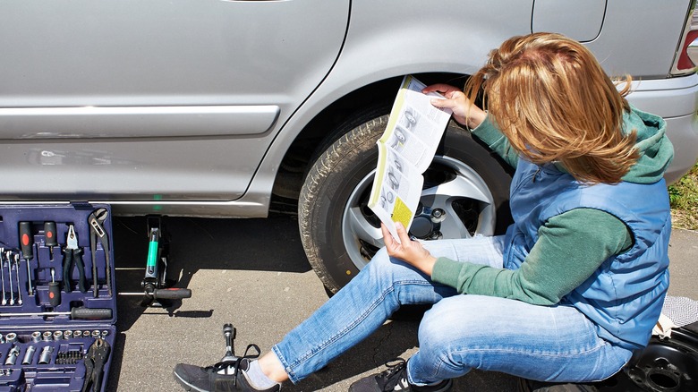 woman reading owner's manual