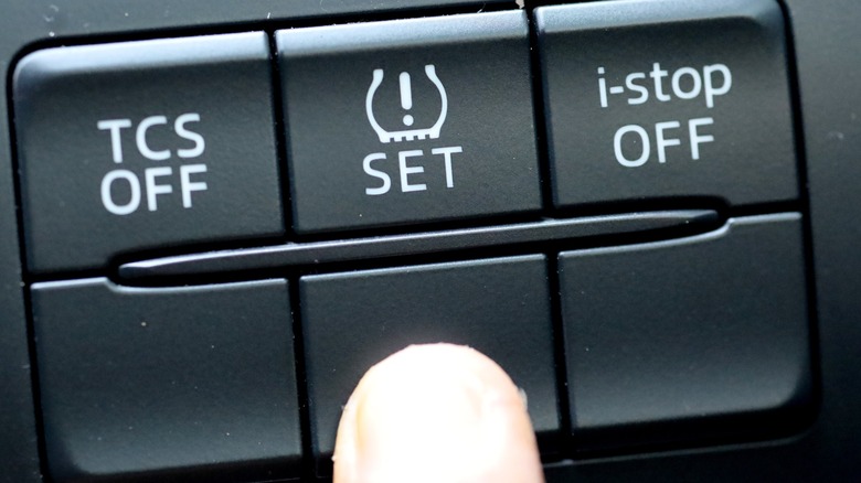 Finger pressing TPMS system in a car