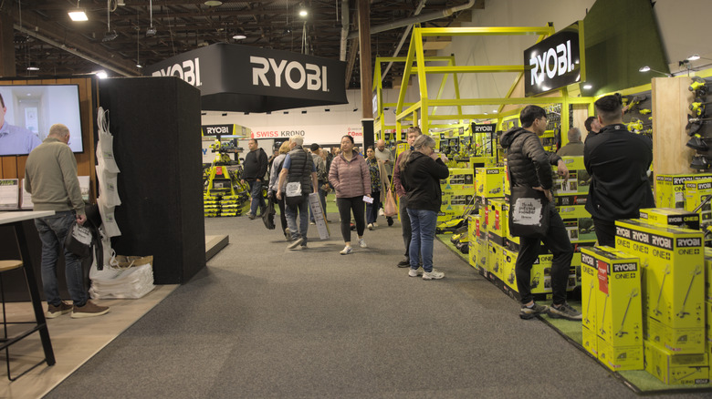 People looking at various Ryobi products