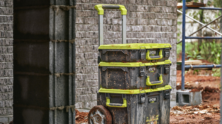 Ryobi tool boxes covered in mud