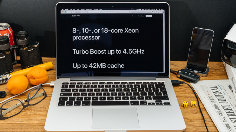 MacBook screen showing technical specs