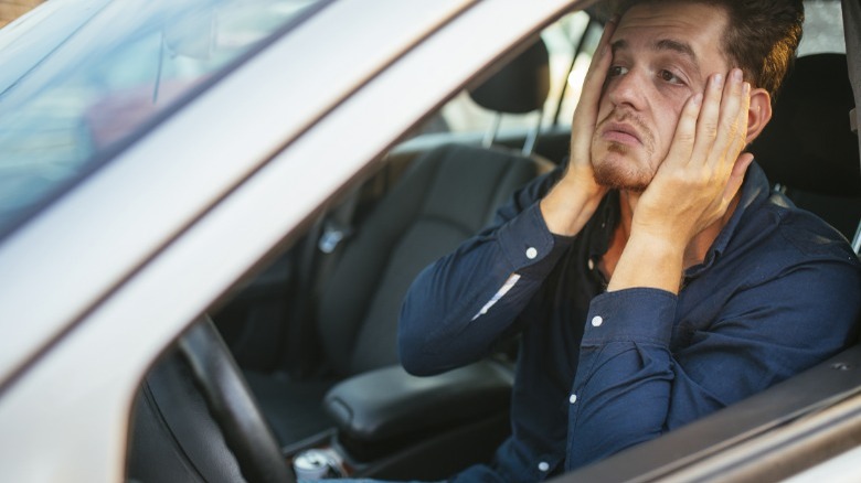 Person stressed in car