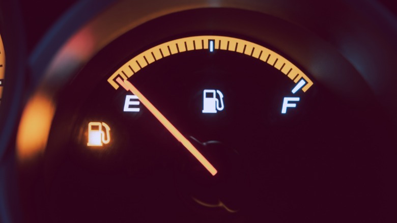 car fuel gauge showing empty