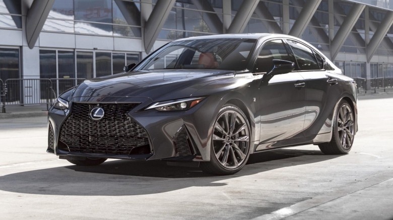 2025 Lexus IS 300 parked on a parked on a paved surface in front of a building