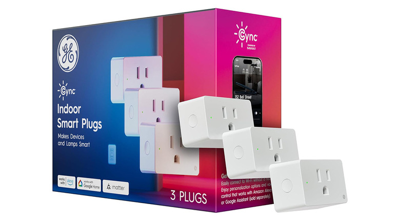 Three Cync smart plugs beside packaging