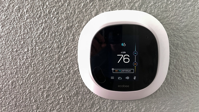 Ecobee smart thermostat mounted on wall