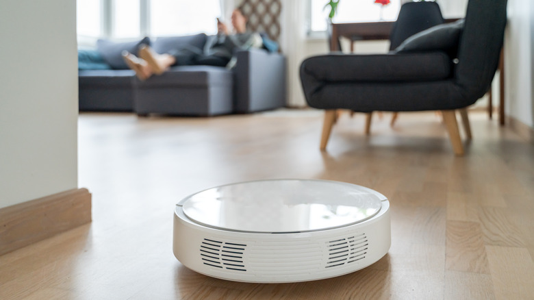 A robot vacuum cleaning a home.