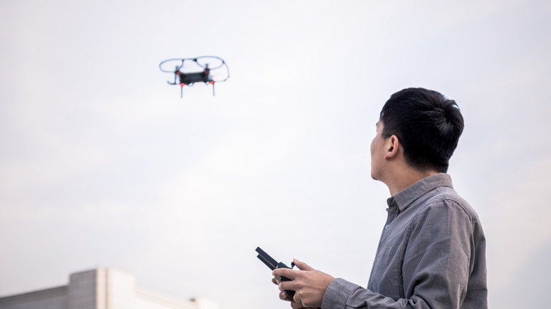 Man using little drone