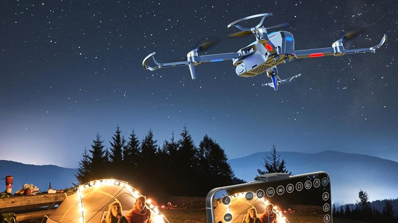 Drone being flown at night with campers below