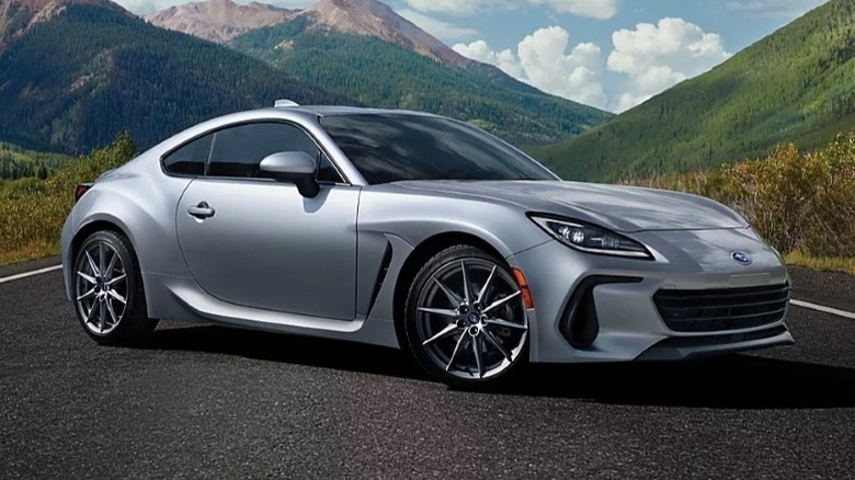 2025 Subaru BZR parked on a road with mountains in the background