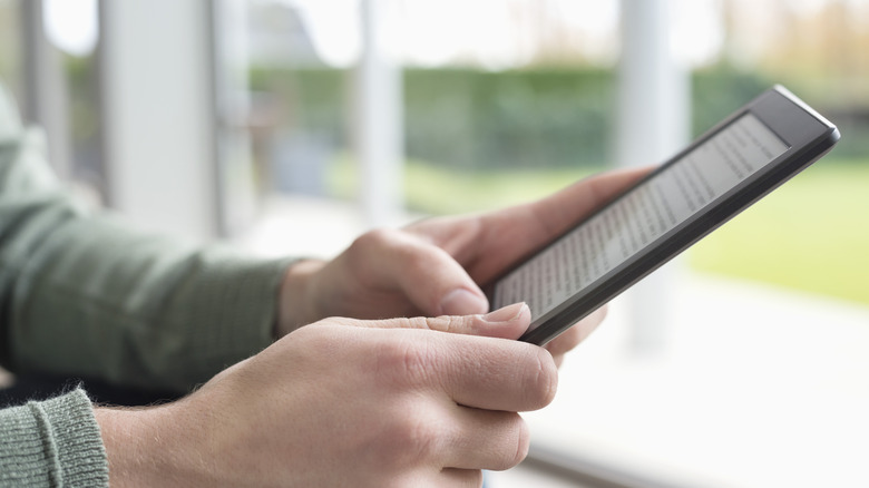 person using a Kindle